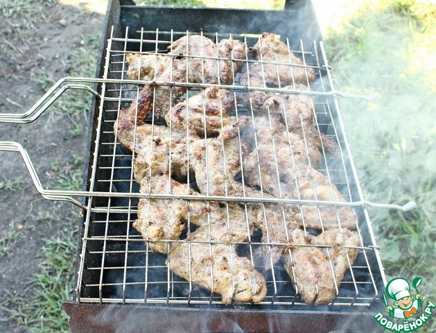 Wings grilled in peanut marinade