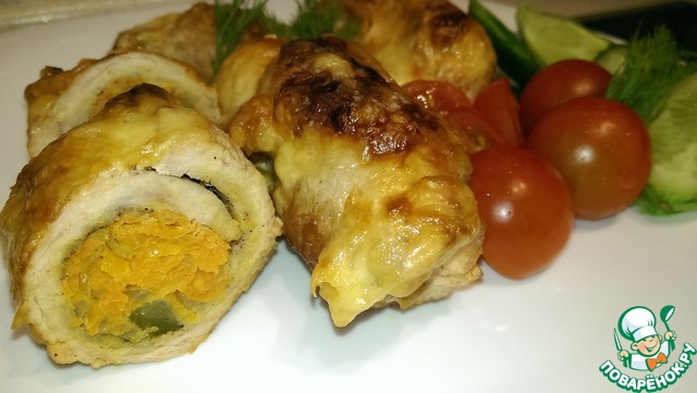 Rolls of pork under cheese crust