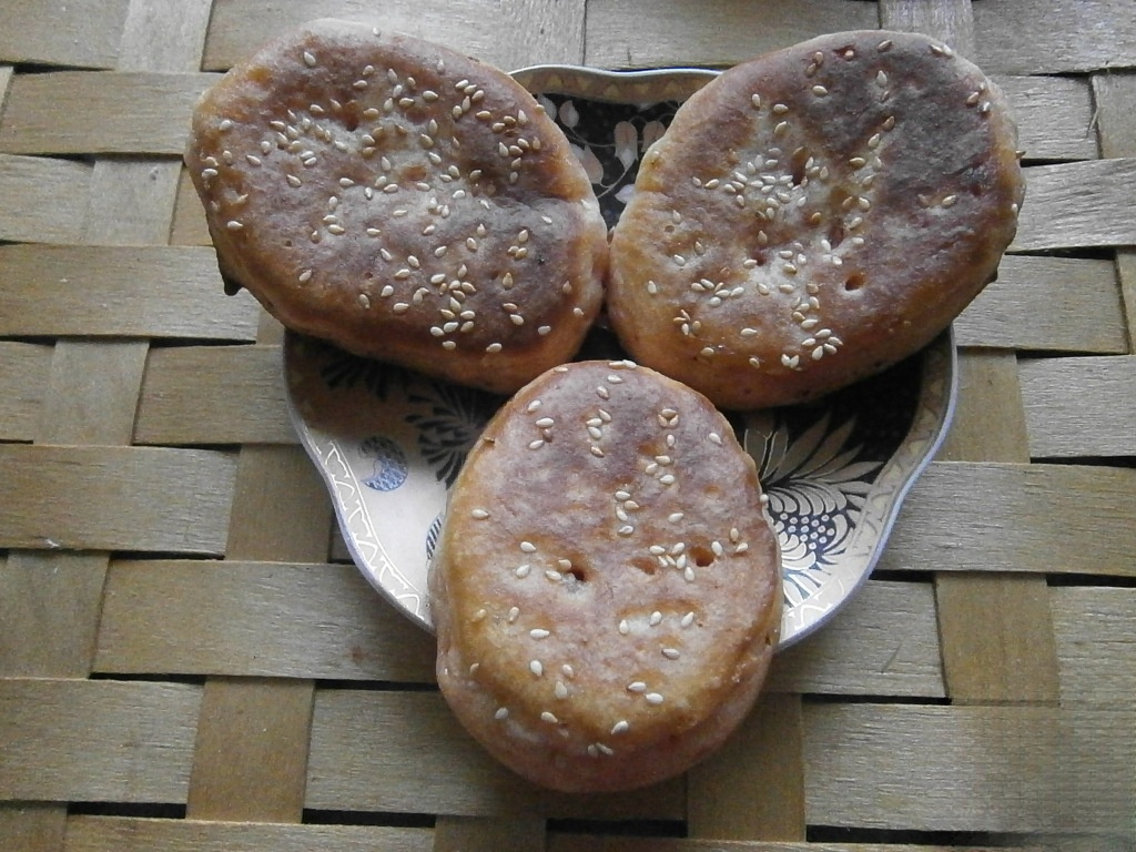 Pancakes with sour cream and yogurt with sesame seeds