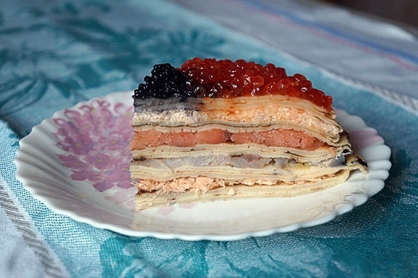 Pancake pie with fish and caviar