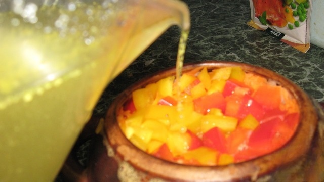 Meat with vegetables in pots