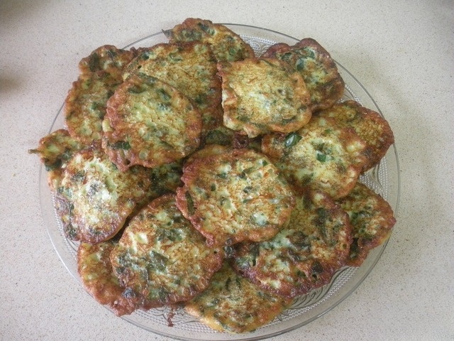 Pancakes made of zucchini with spinach