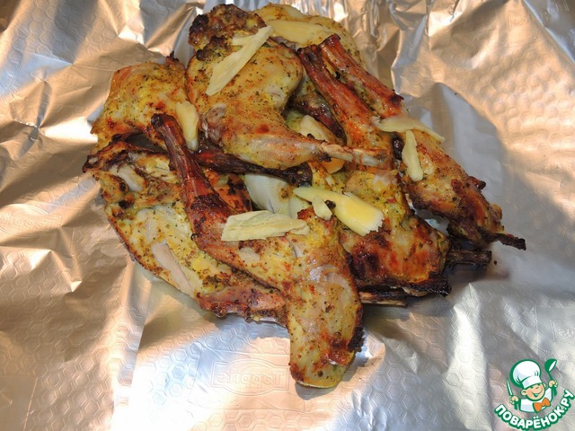 Rabbit legs grilled in yogurt marinade