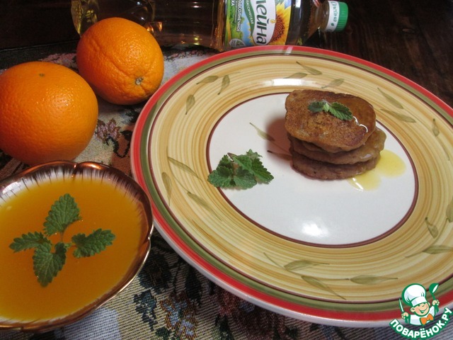 Pancake made of buckwheat flour with orange-mint sauce
