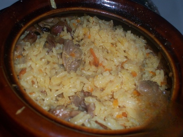 Rice in pot with chicken navels