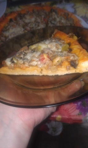 The pizza is leavened with mushrooms and meat