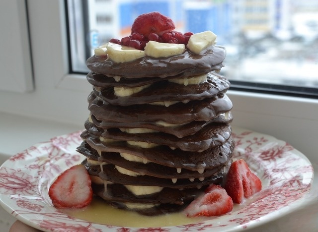 Chocolate pancakes with caramel and banana
