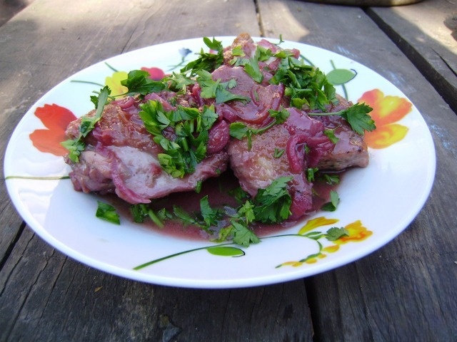 Chicken stewed with cherries and wine