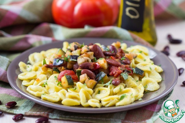 Homemade pasta orecchiette with stew of vegetables and beans