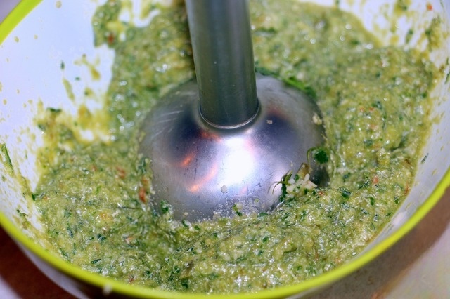 Fish souffle under the green cheese sauce