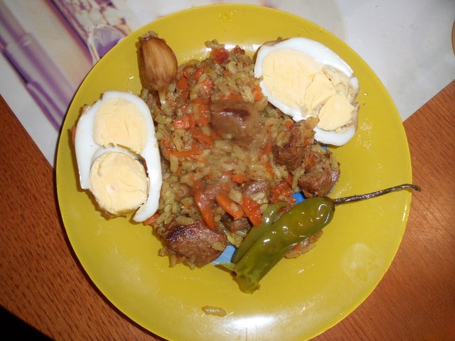 Pilaf with stuffed vine leaves in markilinski