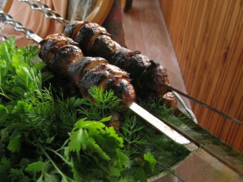 Potatoes with bacon on the coals