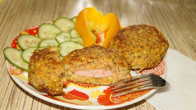 Hrechanyky with sprouted waving and sausage