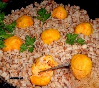 Buckwheat in a pan with fish balls