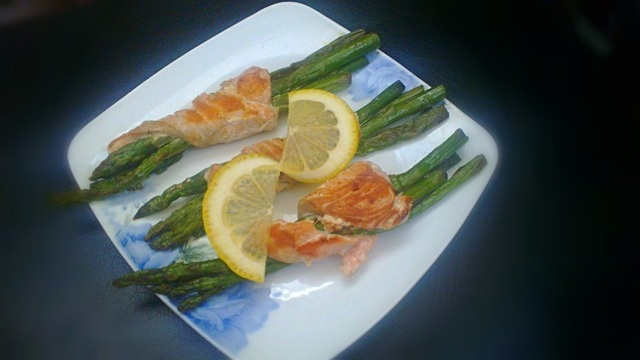 Asparagus in streamers of red fish