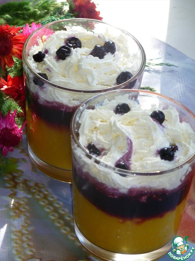 Cocktail-a dessert with mango and blueberries