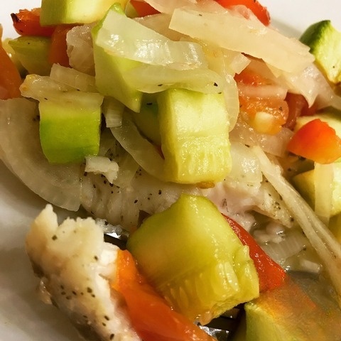 Fish fillet topped assorted vegetables