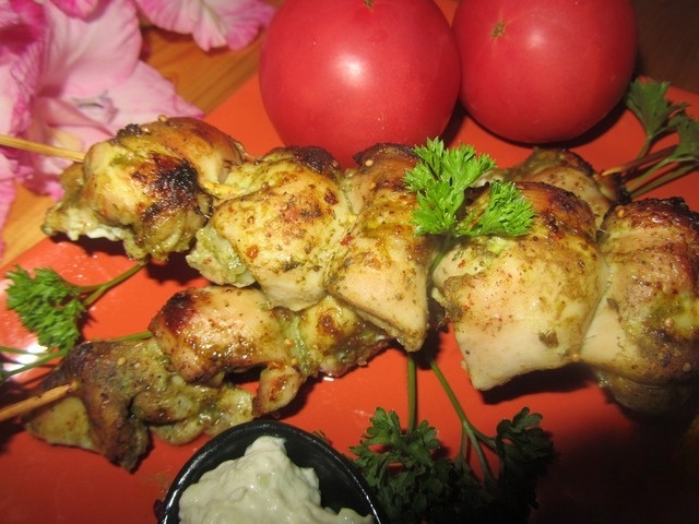 Chicken skewers in green marinade