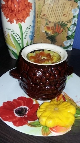 Chicken in a pot with dried apricots